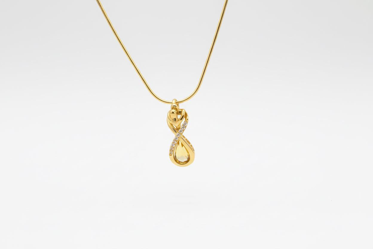 Gold necklace with a pendant on a white background