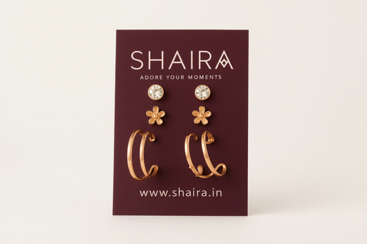 Shaira earrings on a branded card with a beige fabric background
